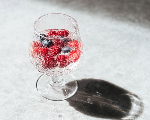 Glass of seltzer water with berries