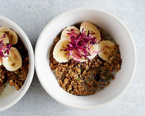 bowl granola bananas and flowers