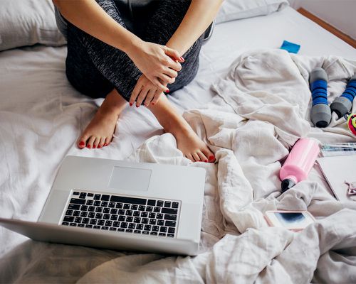 person watching video in bed 