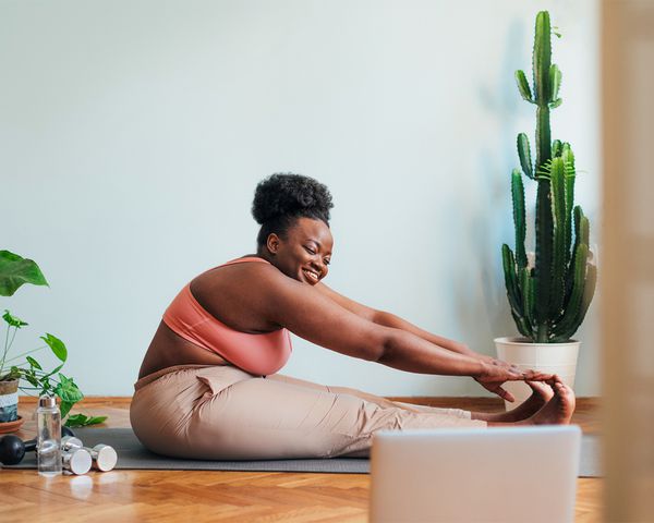 person stretching at home