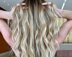 Rear view of teasylights on wavy blonde hair