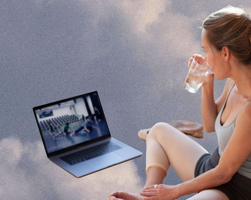 Woman watching ballet class on computer