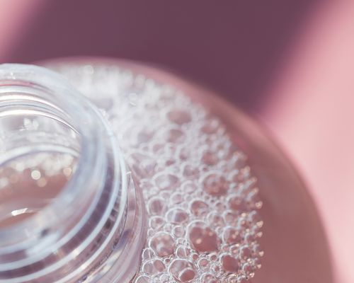 Close up of the bubbles in a skincare bottle