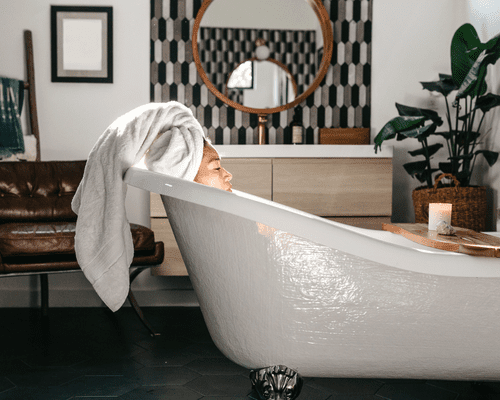 Woman relaxing in a bath