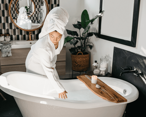 woman preparing warm bath