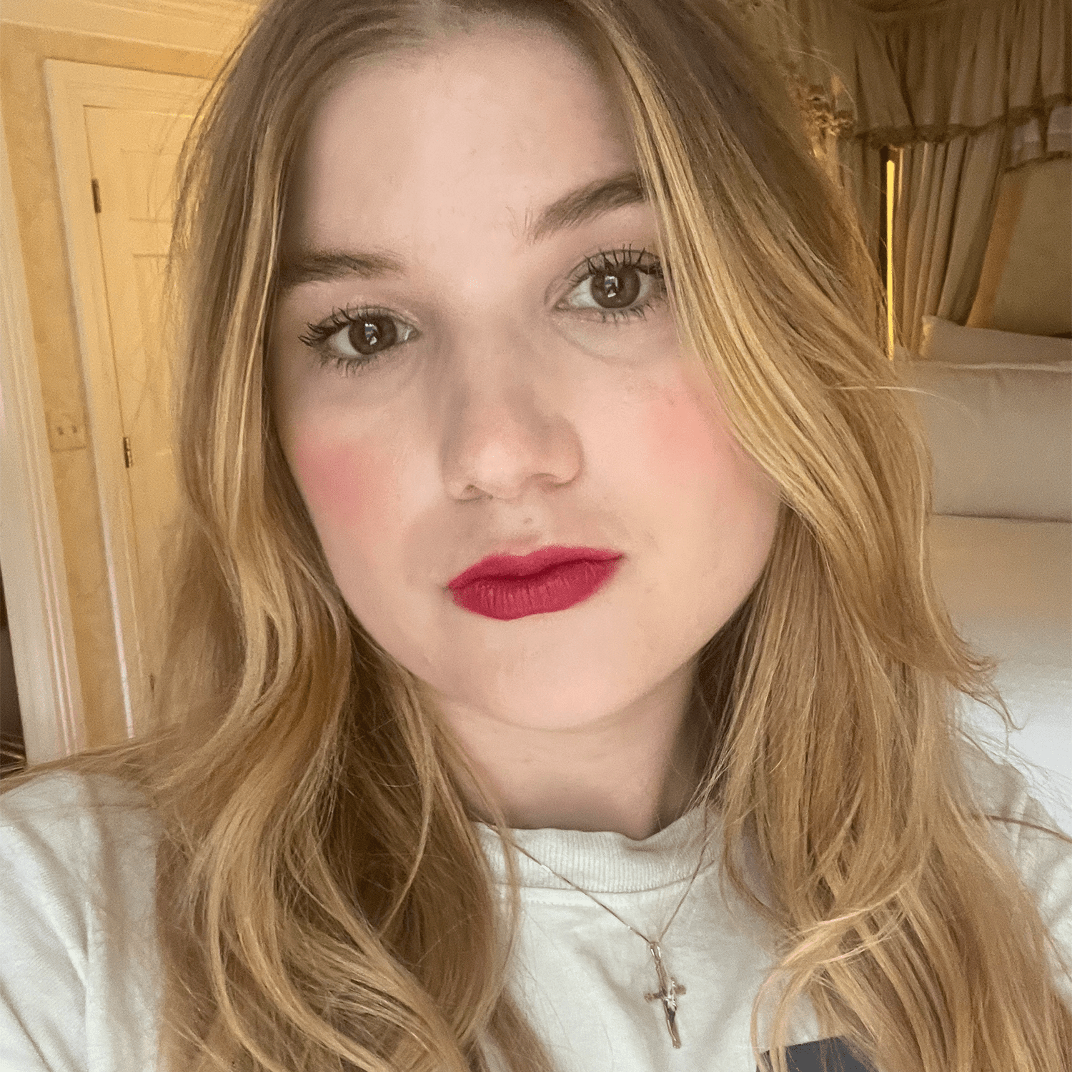 Bella wears Charlotte Tilbury Lip Blur in Ruby Blur 