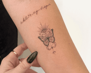 Close up of an arm with a butterfly tattoo