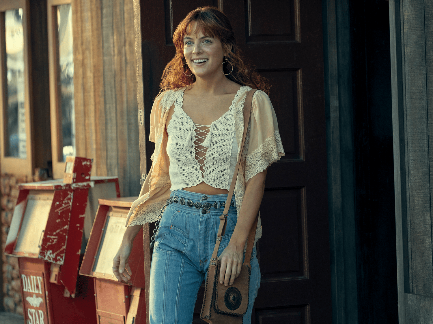 Riley Keough in Daisy Jones and the Six Wearing white peasant top