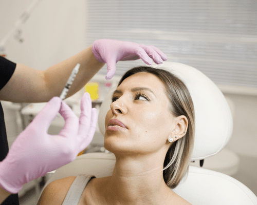 Close up of a woman getting facial injectables