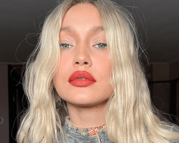 Gigi Hadid wearing red lipstick summer 2023 makeup trend