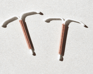 copper iud on white background