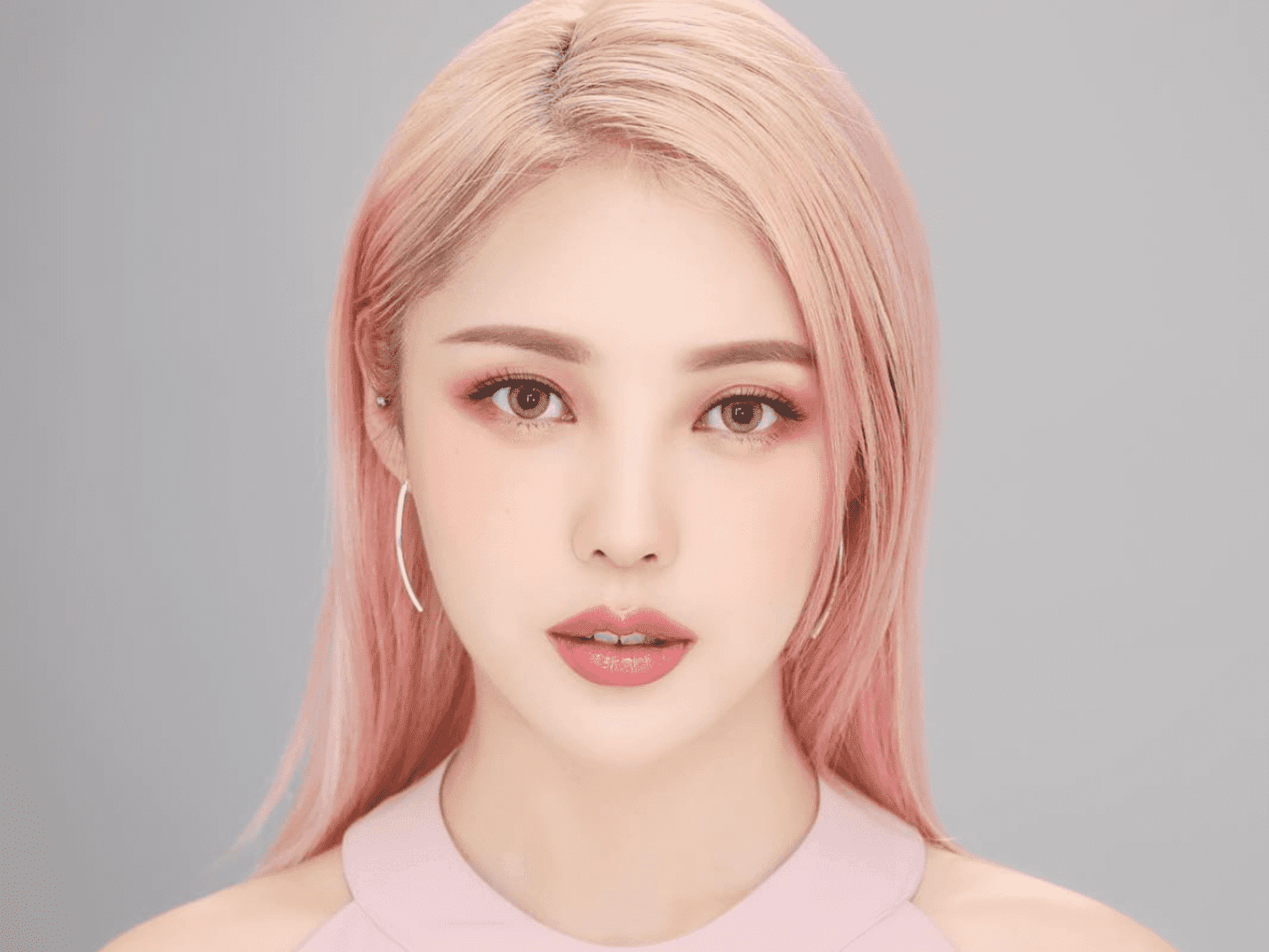 Korean girl with pink hair and blurred skin