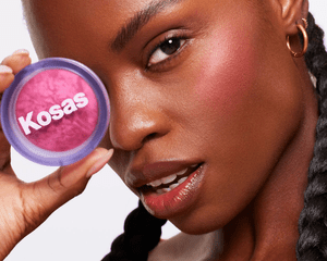 Woman holding Kosas powder blush