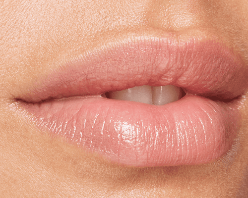 close up of woman with shiny pink lips