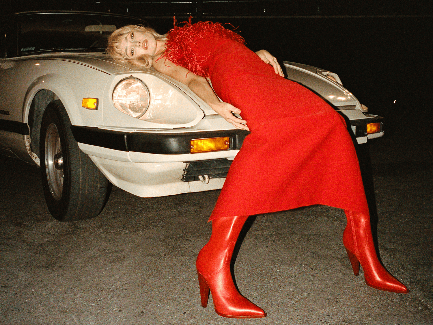 Model in a red dress and red boots