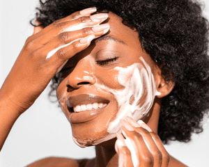 Close up of woman washing her face