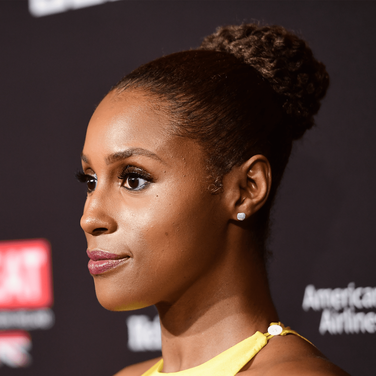 Issa Rae wearing a sleek bun