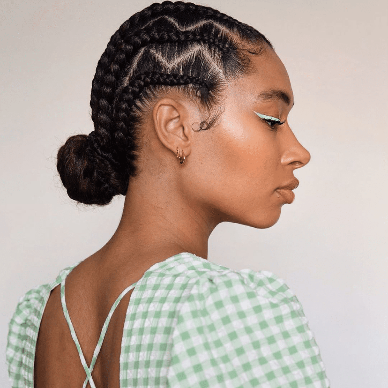 woman wearing low braided bun