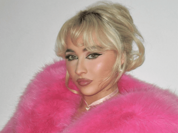 Sabrina Carpenter wearing pink fur