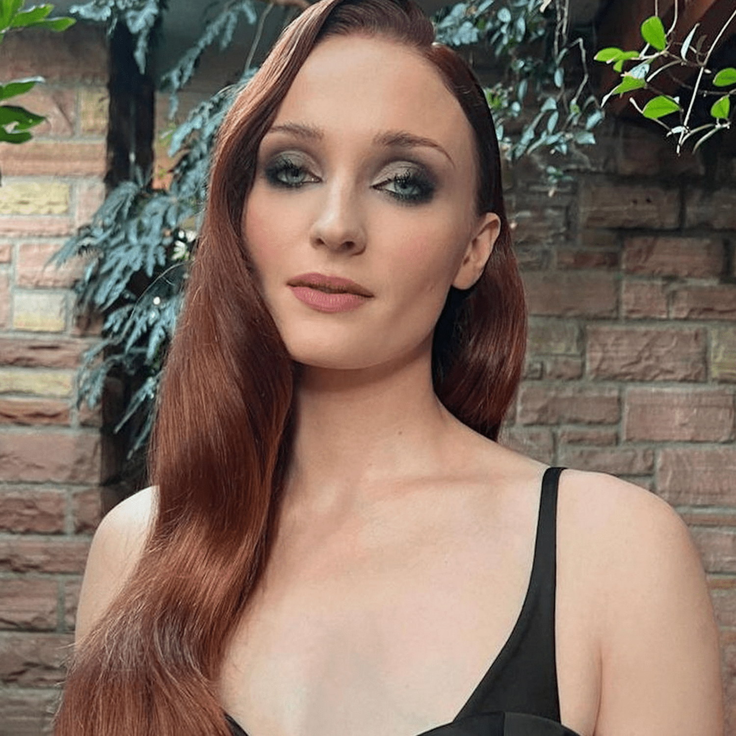 Sophie Turner with deep copper hair