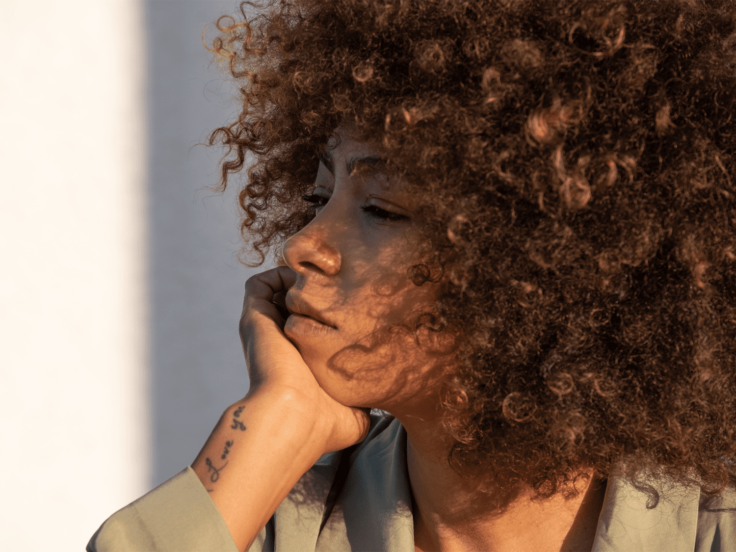 Portrait Of Woman With Afro And Tattoos