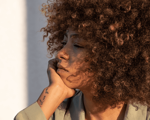 Portrait Of Woman With Afro And Tattoos